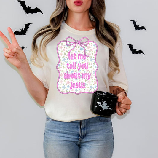 A woman wearing a white t-shirt with a graphic design and holding a black mug with a star and bat design.