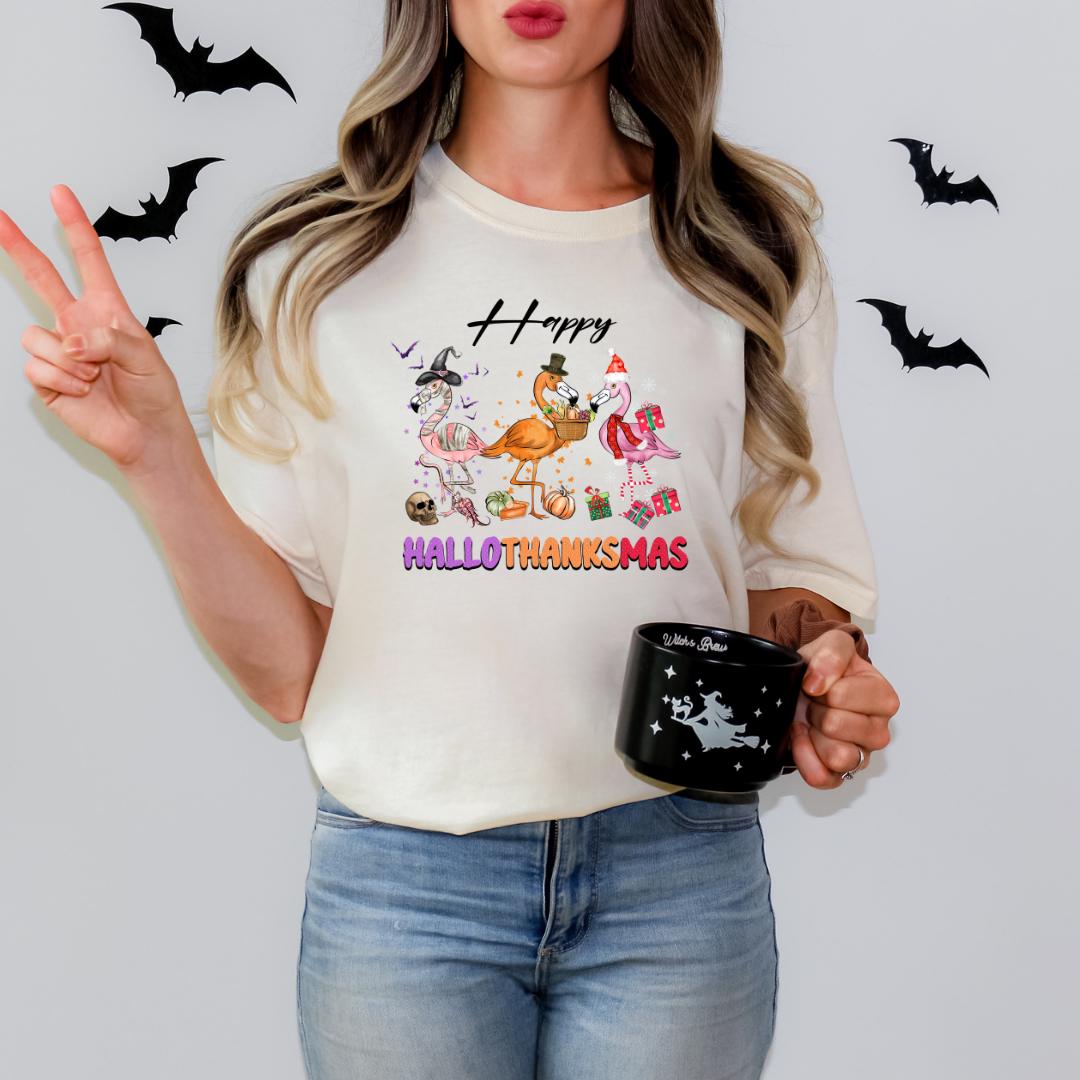 A woman wearing a white t-shirt with a Halloween-themed graphic and holding a black mug with a star design.