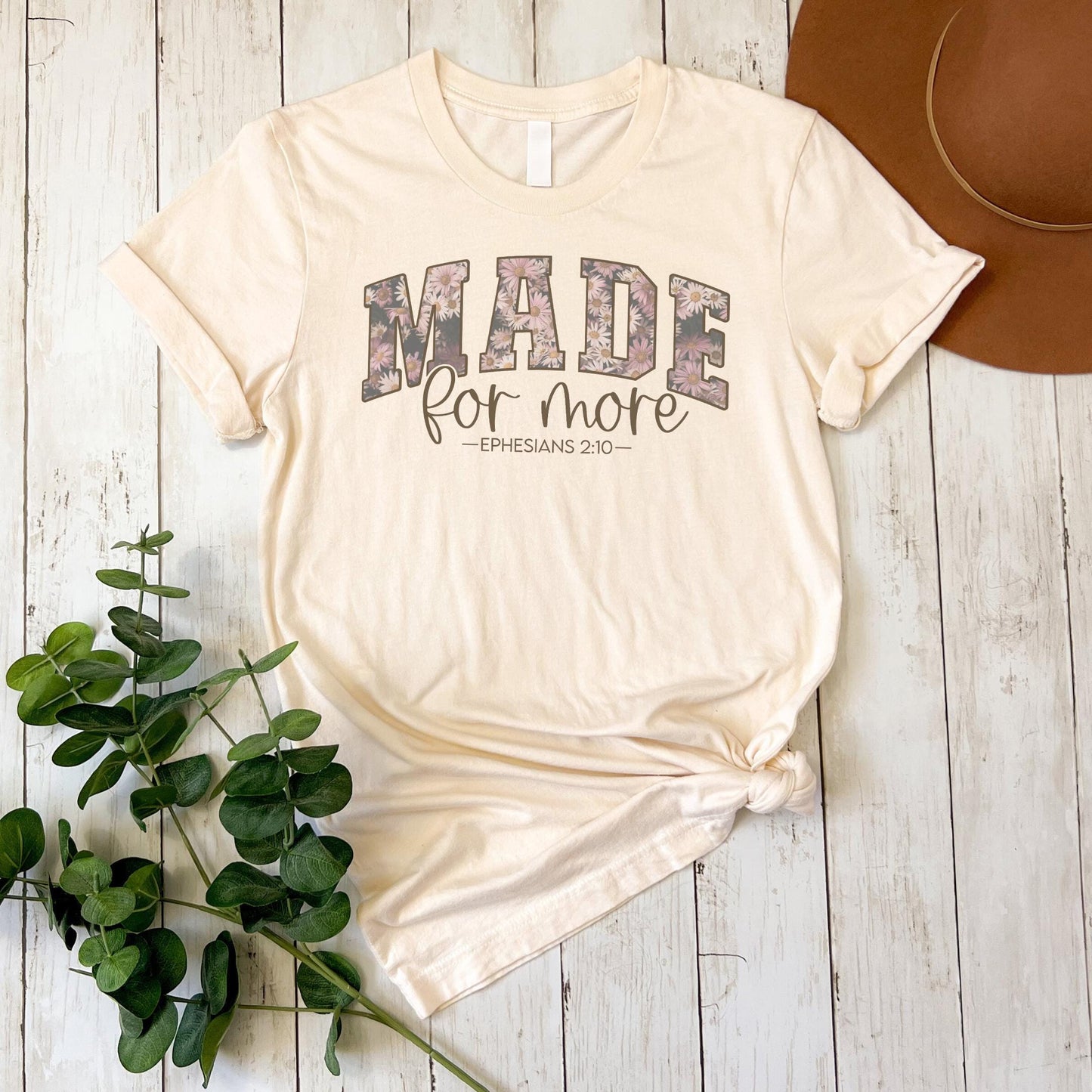 a t - shirt with the words made for more printed on it