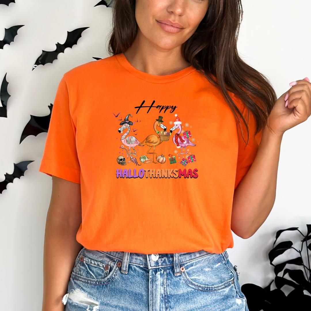 A woman wearing an orange t-shirt with a Halloween-themed graphic and text.